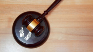 judge's gavel with split house key chain representing property division in divorce 